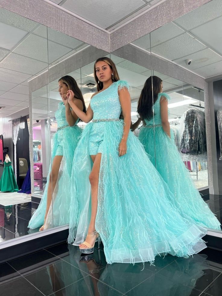 This fabulous aqua, sequin, one shoulder romper with a touch