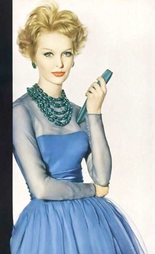 Model Sara Thom in a lovely blue silk organdie dress by Harv