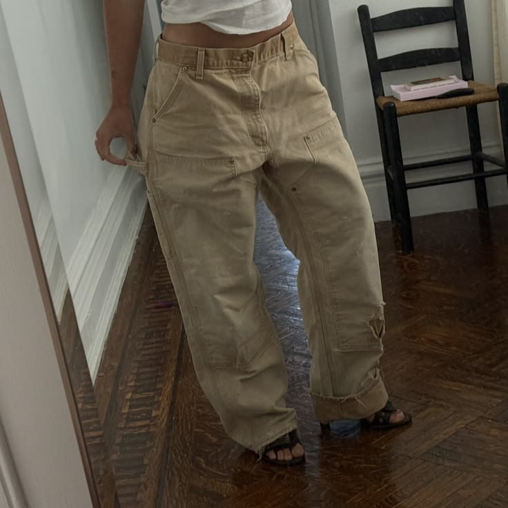 Vintage Tan Carhartt double knee jeans with a distressed fad