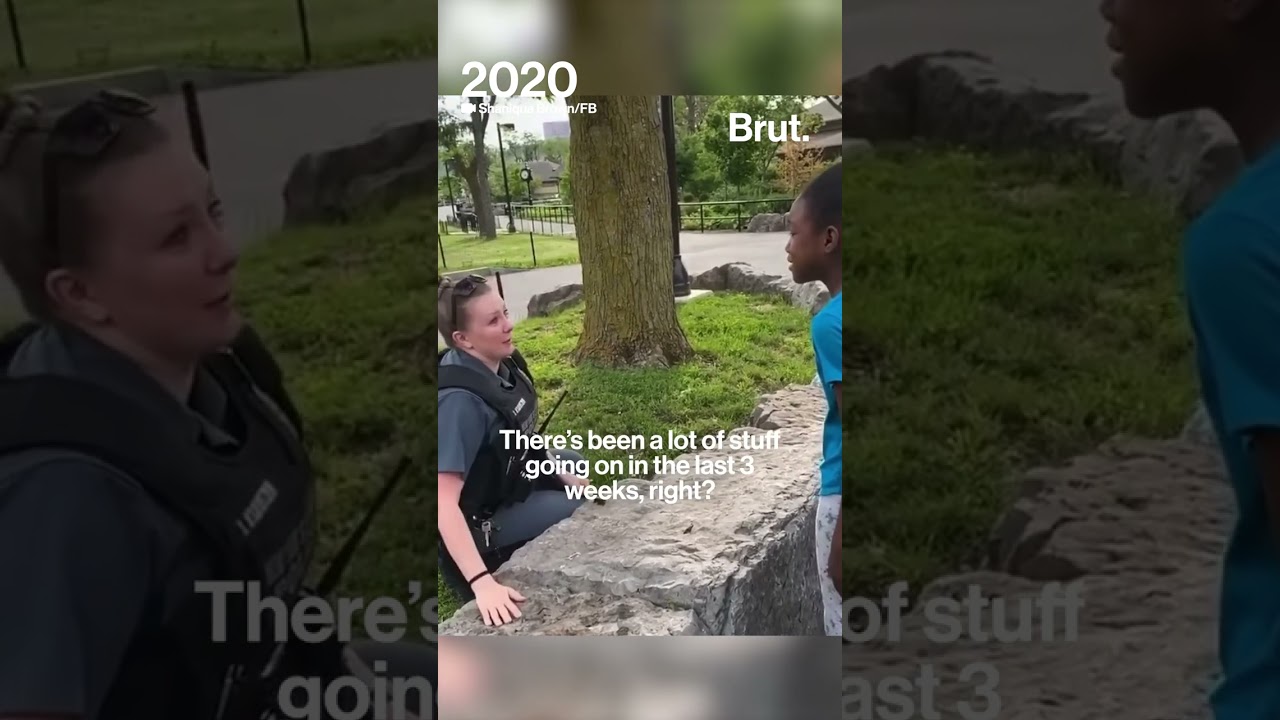 Officer encourages young girl not to be afraid of police.
