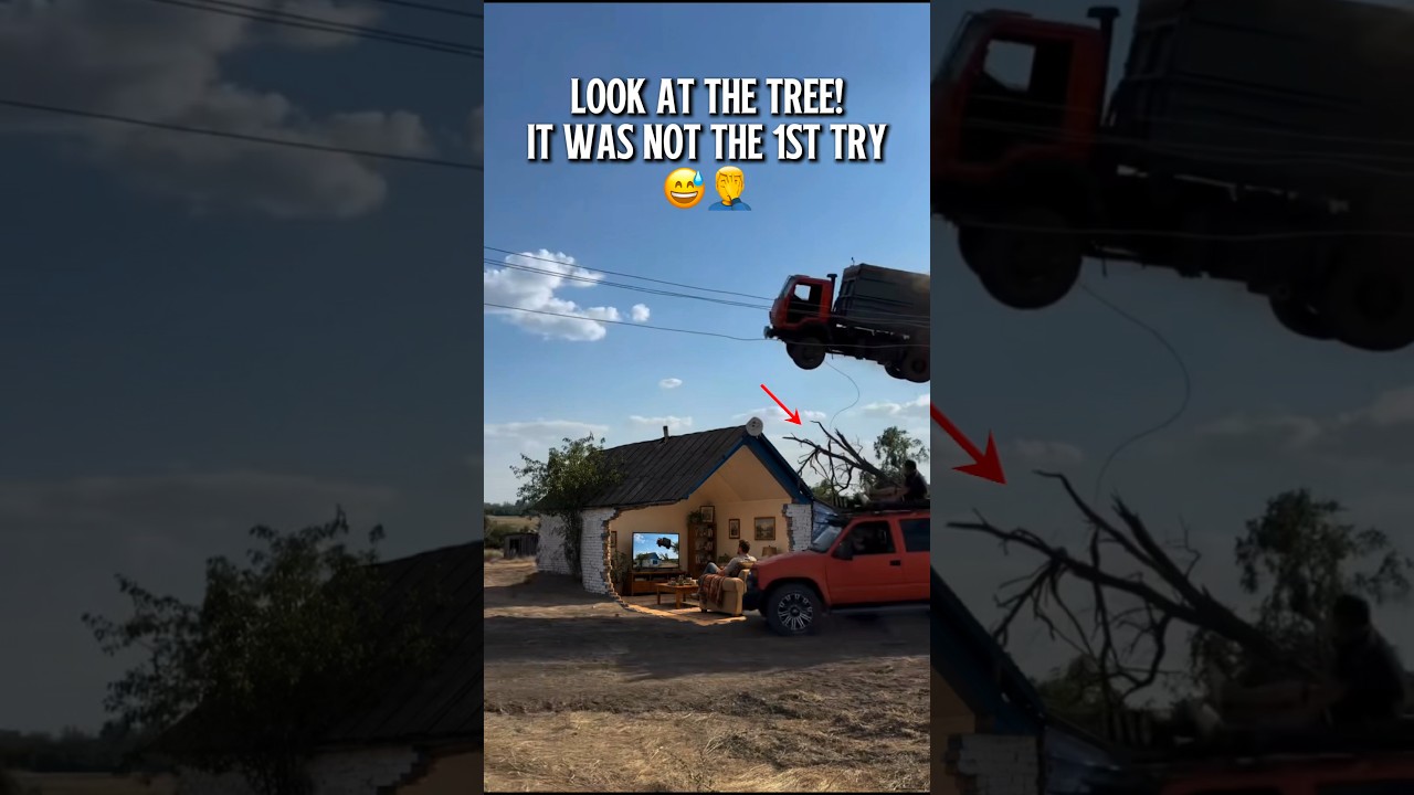 Cabover truck flying over a house