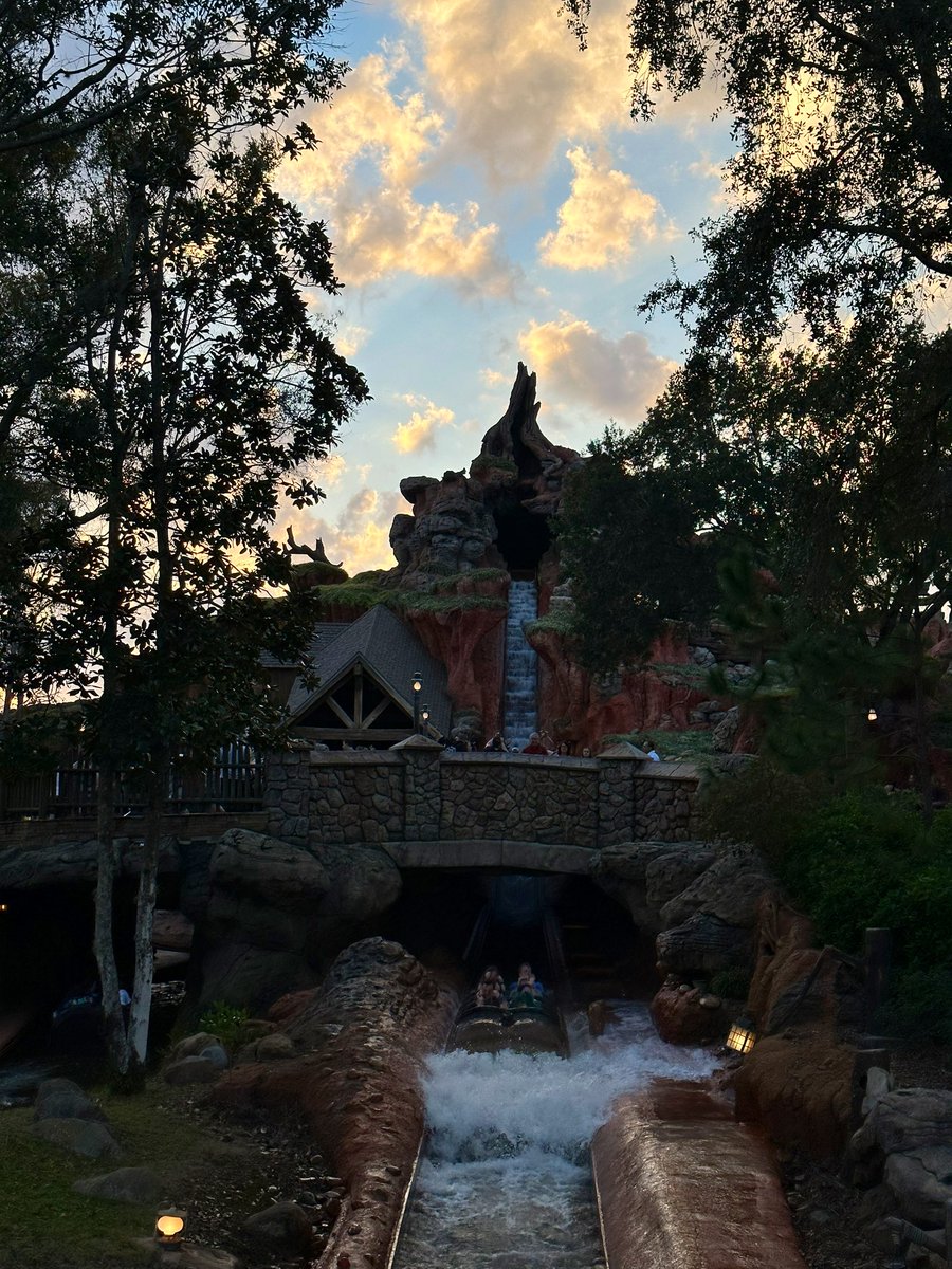 The sun is setting on Splash Mountain at the Magic Kingdom 