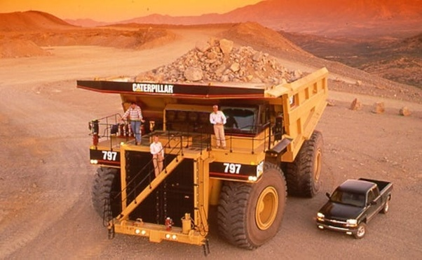 How do the really giant vehicles (like pit mine trucks) that are obviously too large for road transport, get to the location where they are used? Answer by Christopher Pellerito: "When Cat delivers a new 797, it arrives in pieces aboard 12 semis, which is to say, 'some assembly 